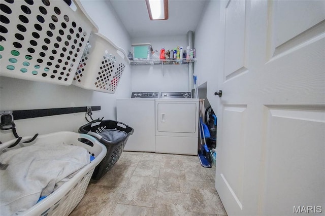 10660 Fawn Rdg, Rolla, MO 65401 - washroom with washing machine and dryer and stone finish flooring
