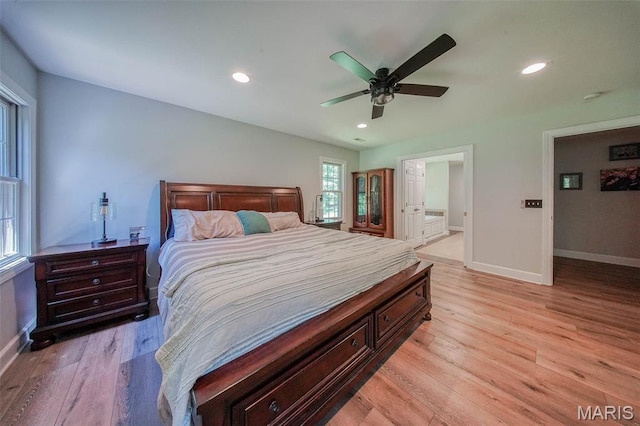 10660 Fawn Rdg, Rolla, MO 65401 - bedroom with baseboards, light wood-style flooring, recessed lighting, and ceiling fan