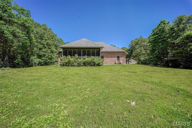 10660 Fawn Rdg, Rolla, MO 65401 - view of green lawn featuring a sunroom