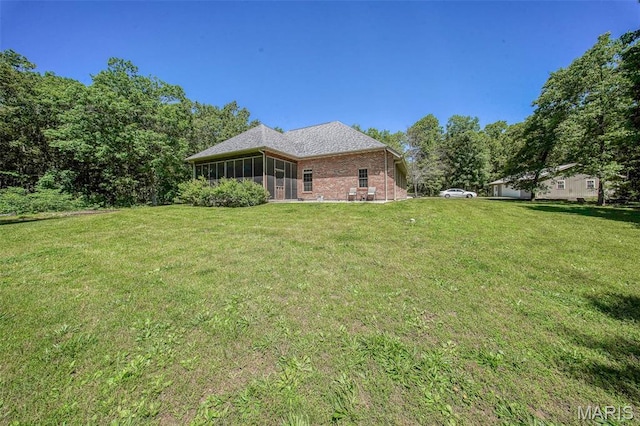 10660 Fawn Rdg, Rolla, MO 65401 - view of grassy yard featuring a sunroom