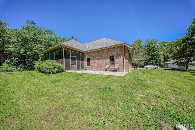 10660 Fawn Rdg, Rolla, MO 65401 - rear view of house featuring a patio, a sunroom, a yard, and brick siding