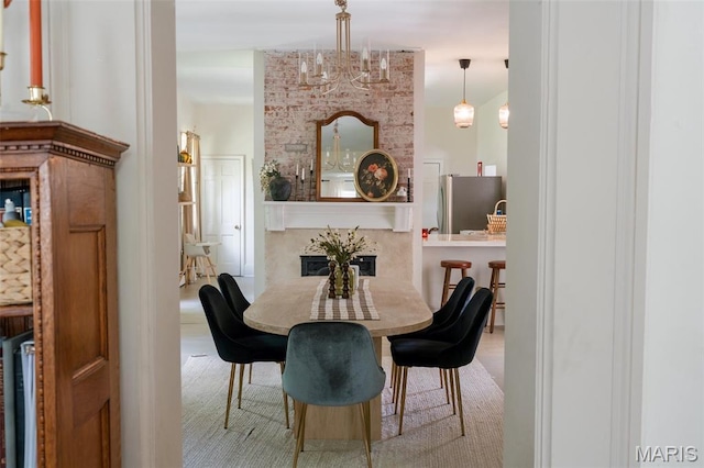 124 W Ross St, Palmyra, MO 63461 - dining room featuring a premium fireplace and a chandelier