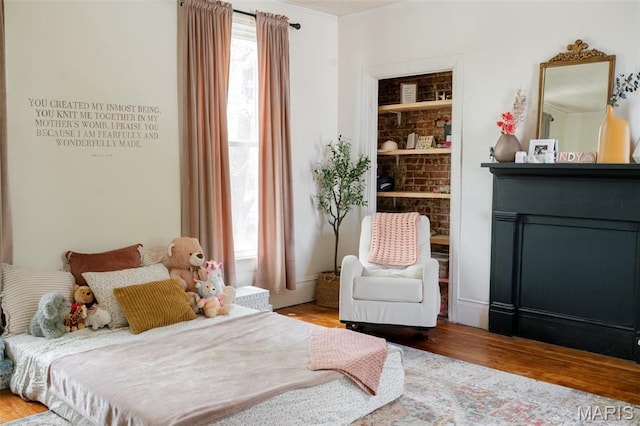 124 W Ross St, Palmyra, MO 63461 - bedroom with wood finished floors and a walk in closet