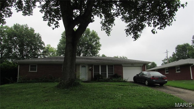 45 Briarwood Dr, Belleville, IL 62223 - ranch-style home with a garage, brick siding, a front lawn, and concrete driveway