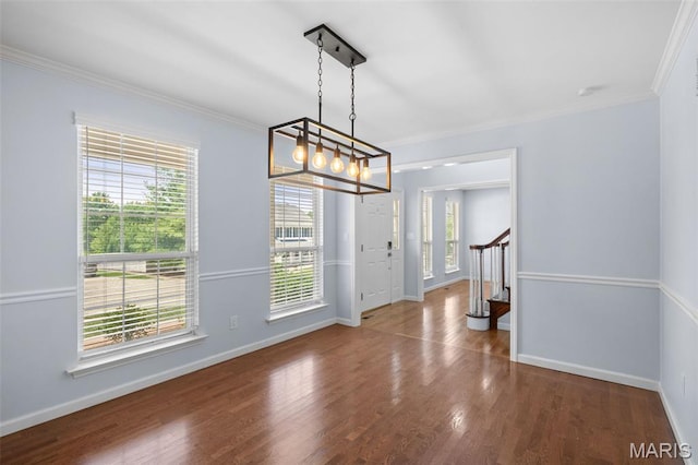 12101 Fahrpark Ln, Saint Louis, MO 63146 - foyer with plenty of natural light, crown molding, wood finished floors, and a chandelier