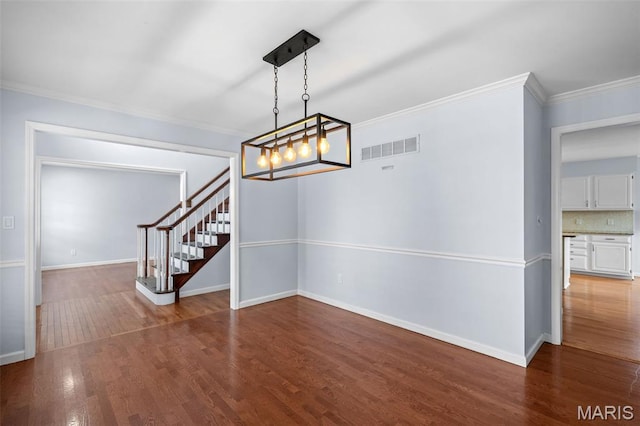 12101 Fahrpark Ln, Saint Louis, MO 63146 - unfurnished dining area featuring stairway, crown molding, wood finished floors, and a chandelier