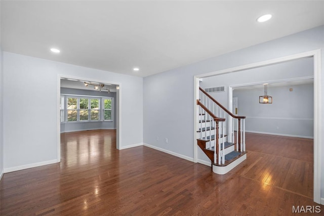 12101 Fahrpark Ln, Saint Louis, MO 63146 - spare room featuring a chandelier, wood finished floors, stairway, and recessed lighting