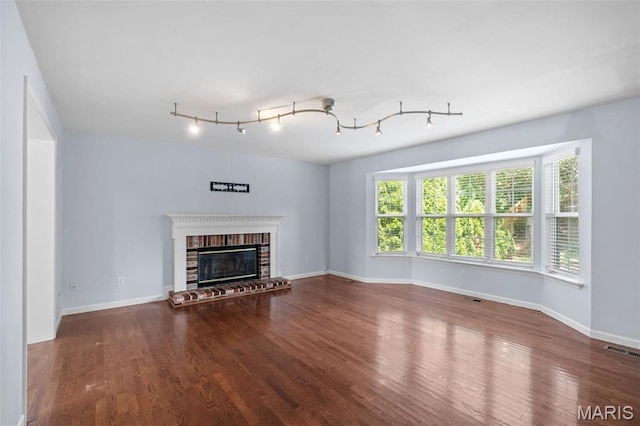 12101 Fahrpark Ln, Saint Louis, MO 63146 - unfurnished living room with wood finished floors and a fireplace