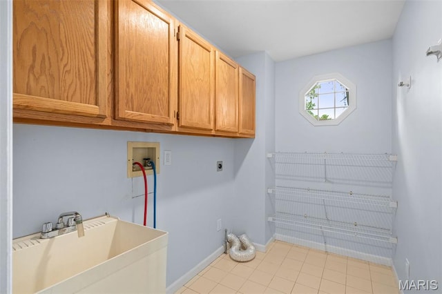 12101 Fahrpark Ln, Saint Louis, MO 63146 - laundry area with electric dryer hookup, cabinet space, washer hookup, and tile patterned floors