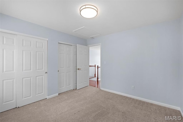 12101 Fahrpark Ln, Saint Louis, MO 63146 - unfurnished bedroom with carpet floors, attic access, and multiple closets