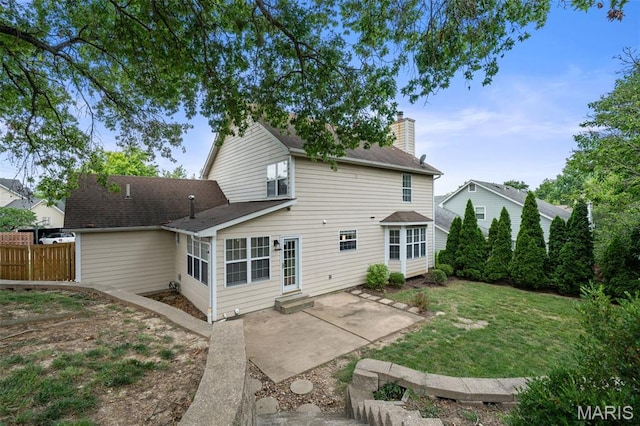 12101 Fahrpark Ln, Saint Louis, MO 63146 - rear view of house featuring a patio, a chimney, a shingled roof, and entry steps