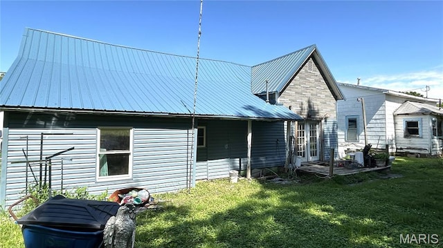 526 N Locust St, Dexter, MO 63841 - back of house featuring a yard and metal roof