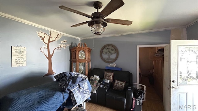 526 N Locust St, Dexter, MO 63841 - bedroom featuring crown molding, wood finished floors, and ceiling fan