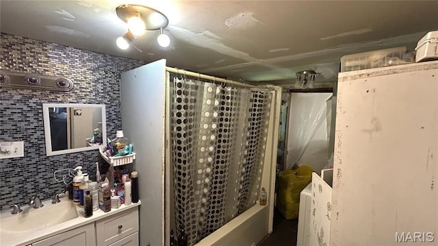 526 N Locust St, Dexter, MO 63841 - bathroom with vanity, shower / bath combination with curtain, and decorative backsplash