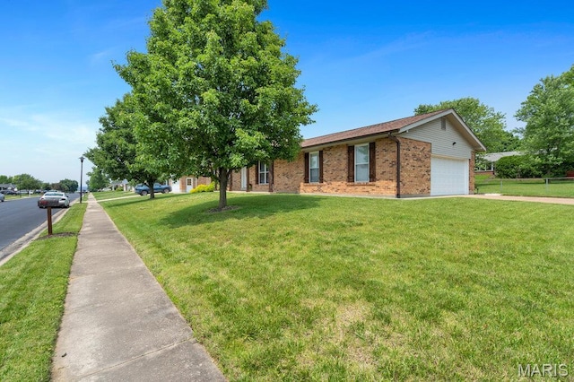 3100 Tally Ho Dr, Saint Charles, MO 63301 - view of front of house with brick siding, a front lawn, a garage, and concrete driveway