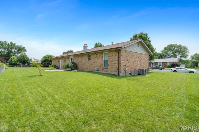 3100 Tally Ho Dr, Saint Charles, MO 63301 - back of property with brick siding and a chimney