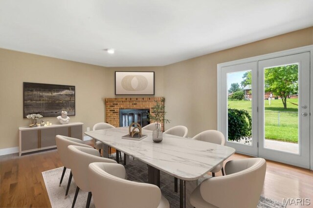 3100 Tally Ho Dr, Saint Charles, MO 63301 - dining room with wood finished floors and a fireplace