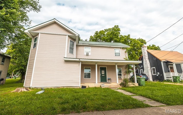 204 N Olive St, Rolla, MO 65401 - view of front facade featuring covered porch, a front lawn, and a metal roof