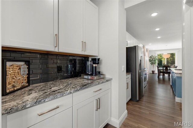 145 Royal Inverness Pkwy, Dardenne Prairie, MO 63368 - kitchen with stainless steel refrigerator with ice dispenser, white cabinets, wood finished floors, recessed lighting, and tasteful backsplash
