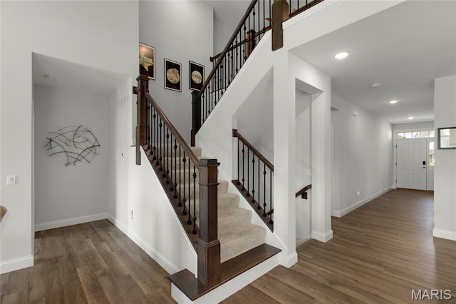145 Royal Inverness Pkwy, Dardenne Prairie, MO 63368 - stairway with wood finished floors, recessed lighting, and a towering ceiling