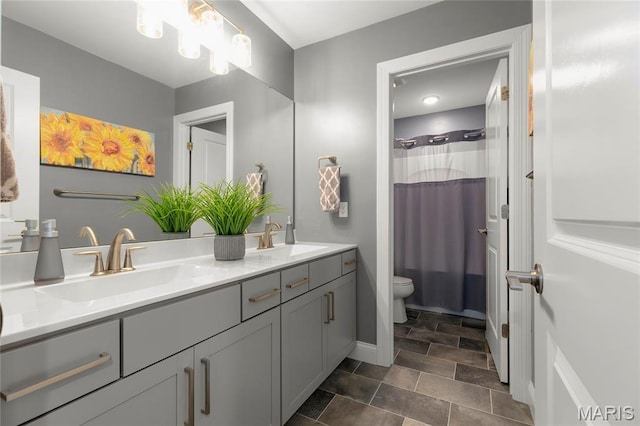 145 Royal Inverness Pkwy, Dardenne Prairie, MO 63368 - bathroom with double vanity, stone finish floors, and curtained shower