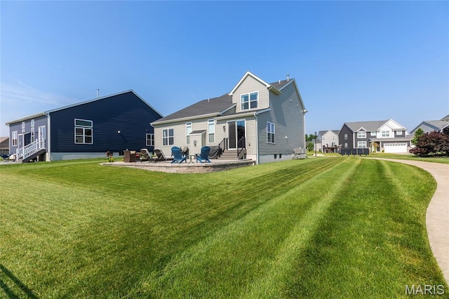 145 Royal Inverness Pkwy, Dardenne Prairie, MO 63368 - rear view of property featuring entry steps, a lawn, and a patio area
