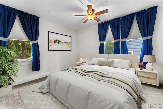 542 S Main St, Waterloo, IL 62298 - carpeted bedroom with baseboards and a ceiling fan