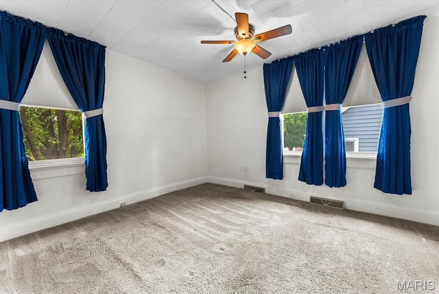 542 S Main St, Waterloo, IL 62298 - carpeted empty room with baseboards and a ceiling fan