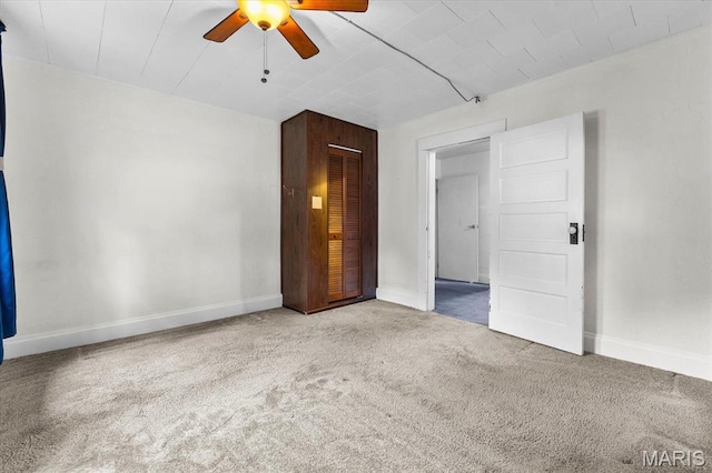 542 S Main St, Waterloo, IL 62298 - unfurnished bedroom featuring carpet floors, baseboards, a ceiling fan, and a closet