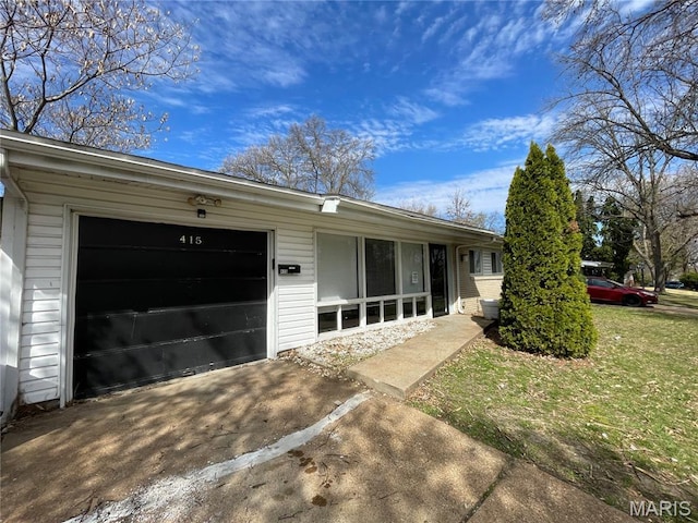 415 Waterford Dr, Florissant, MO 63033 - view of front of house with driveway and a garage