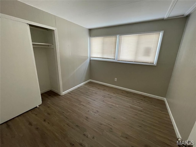 415 Waterford Dr, Florissant, MO 63033 - unfurnished bedroom with wood finished floors and a closet