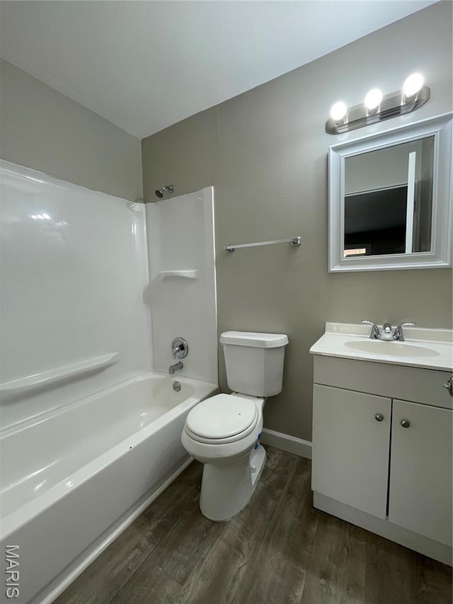 415 Waterford Dr, Florissant, MO 63033 - bathroom featuring wood finished floors, vanity, and tub / shower combination