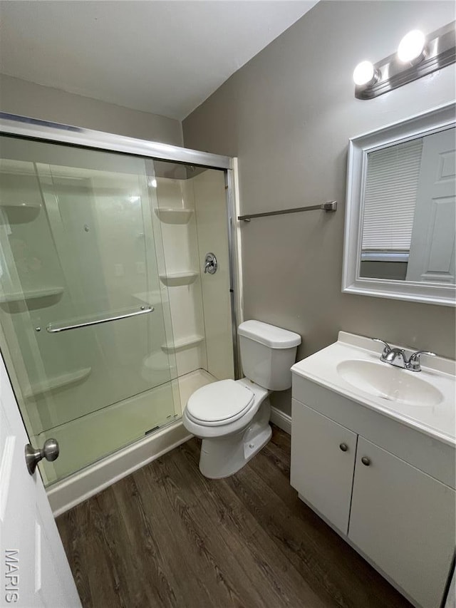 415 Waterford Dr, Florissant, MO 63033 - full bathroom with wood finished floors, vanity, and a shower stall