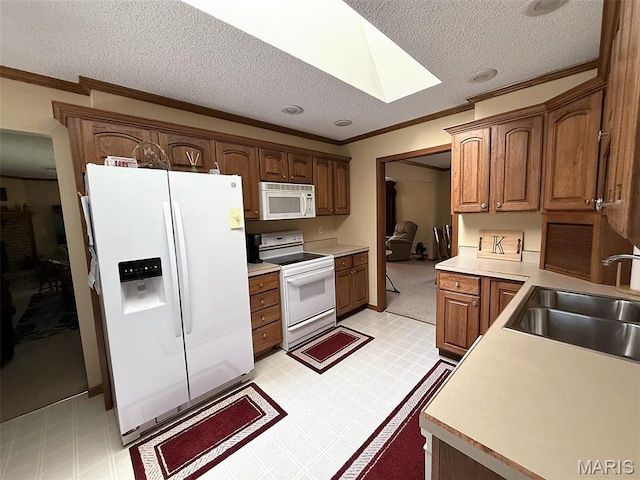 106 Woodland Hills Ct, Vandalia, IL 62471 - kitchen with white appliances, ornamental molding, light floors, a textured ceiling, and light countertops