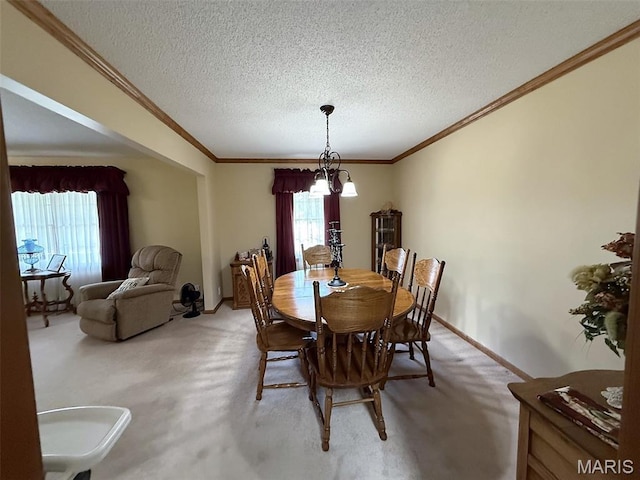 106 Woodland Hills Ct, Vandalia, IL 62471 - dining room with light carpet, healthy amount of natural light, crown molding, and a textured ceiling