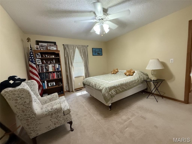 106 Woodland Hills Ct, Vandalia, IL 62471 - bedroom with light carpet, a textured ceiling, and a ceiling fan