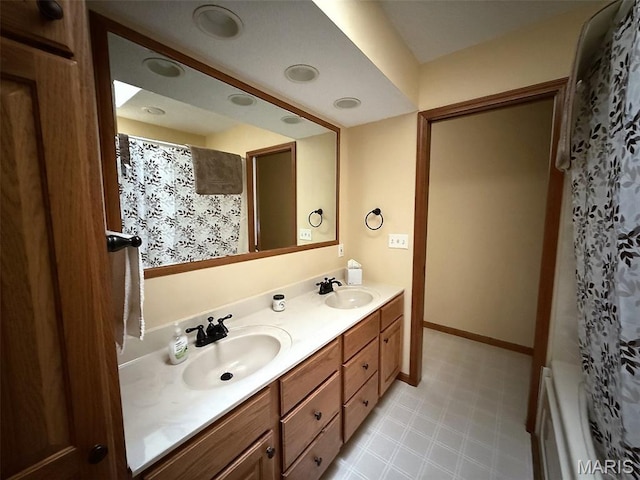 106 Woodland Hills Ct, Vandalia, IL 62471 - bathroom featuring double vanity and baseboards