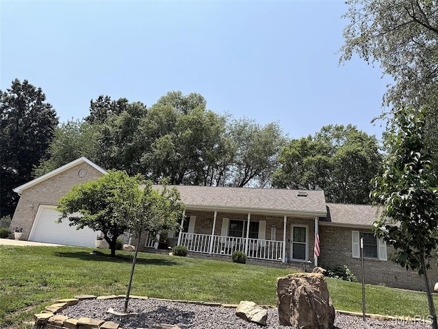 106 Woodland Hills Ct, Vandalia, IL 62471 - ranch-style home with covered porch, a front yard, and brick siding