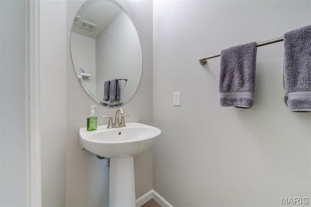 3325 Charlestowne Crossing Dr, Saint Charles, MO 63301 - bathroom featuring baseboards and a sink