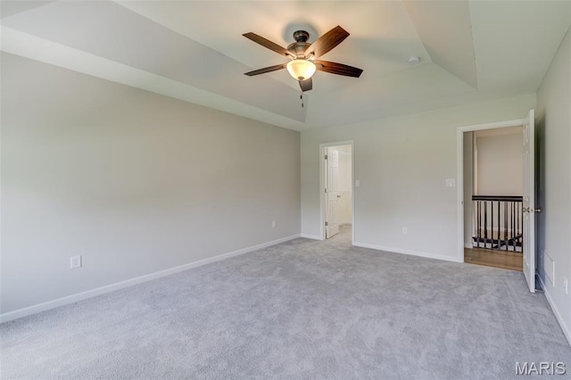 3325 Charlestowne Crossing Dr, Saint Charles, MO 63301 - spare room featuring a ceiling fan, carpet floors, and a raised ceiling
