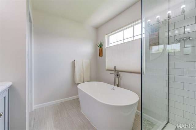 3325 Charlestowne Crossing Dr, Saint Charles, MO 63301 - full bath featuring a freestanding tub, walk in shower, and vanity