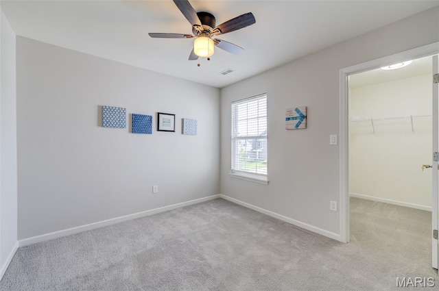 3325 Charlestowne Crossing Dr, Saint Charles, MO 63301 - unfurnished bedroom with carpet flooring, a walk in closet, a closet, and ceiling fan