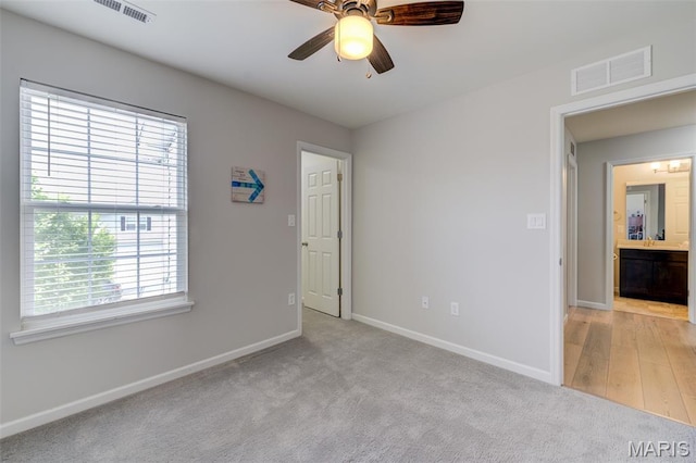 3325 Charlestowne Crossing Dr, Saint Charles, MO 63301 - unfurnished bedroom featuring light colored carpet and a ceiling fan