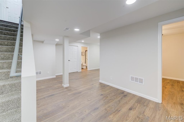 3325 Charlestowne Crossing Dr, Saint Charles, MO 63301 - finished below grade area featuring wood finished floors, stairs, and recessed lighting