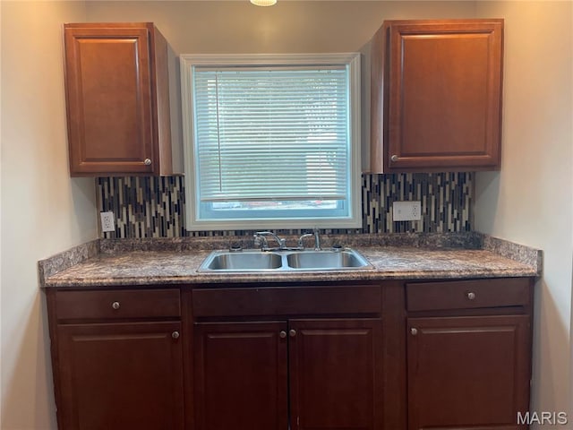 6155 Emerald Ave, Saint Louis, MO 63135 - kitchen with decorative backsplash and dark countertops