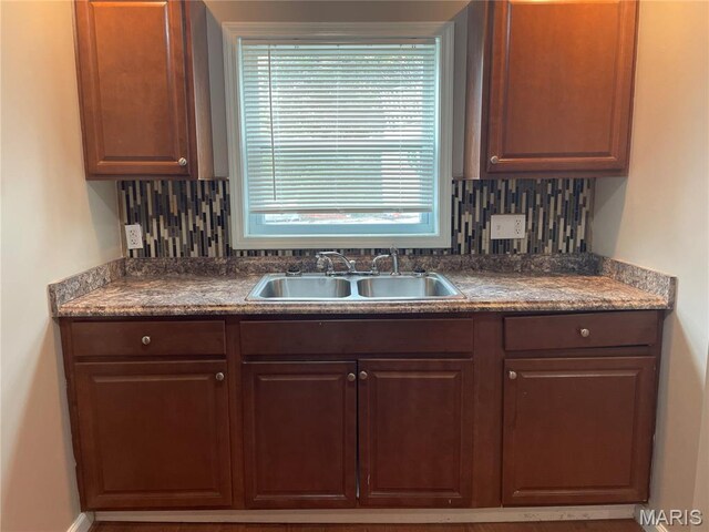 6155 Emerald Ave, Saint Louis, MO 63135 - kitchen with decorative backsplash and dark countertops