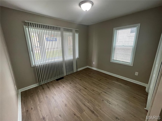 6155 Emerald Ave, Saint Louis, MO 63135 - empty room with wood finished floors and baseboards