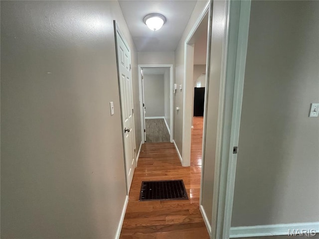 6155 Emerald Ave, Saint Louis, MO 63135 - hall with wood finished floors and baseboards