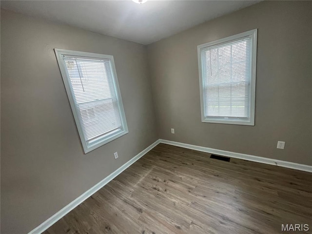 6155 Emerald Ave, Saint Louis, MO 63135 - unfurnished room with wood finished floors and baseboards