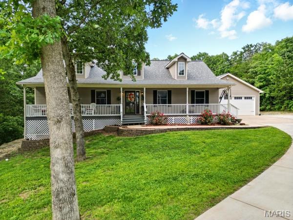 9 Sun Trail, Rise Trail, MO 63050 - view of front of house featuring a porch and a front yard